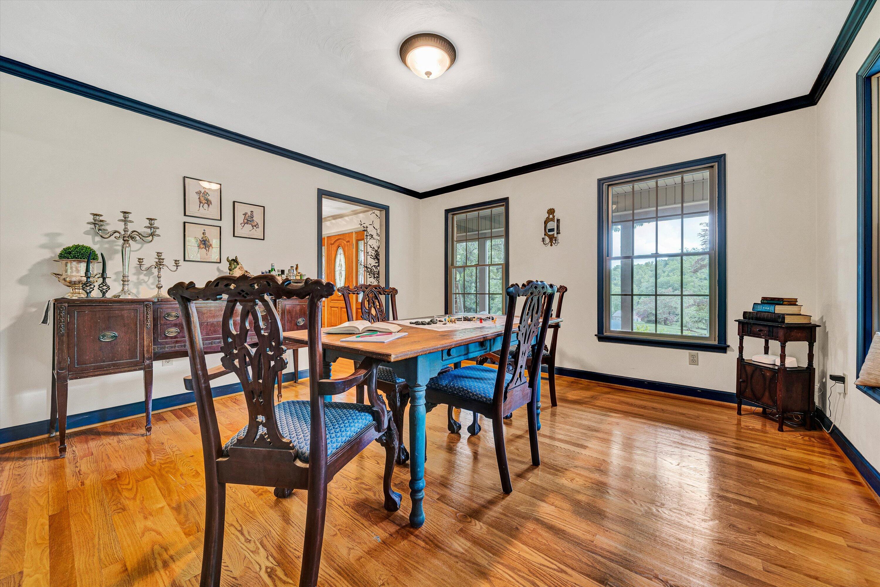 5531 Bethlehem Road Boones Mill, VA 24065 - Photo 14 of 69 a view of a dining room with furniture and wooden floor