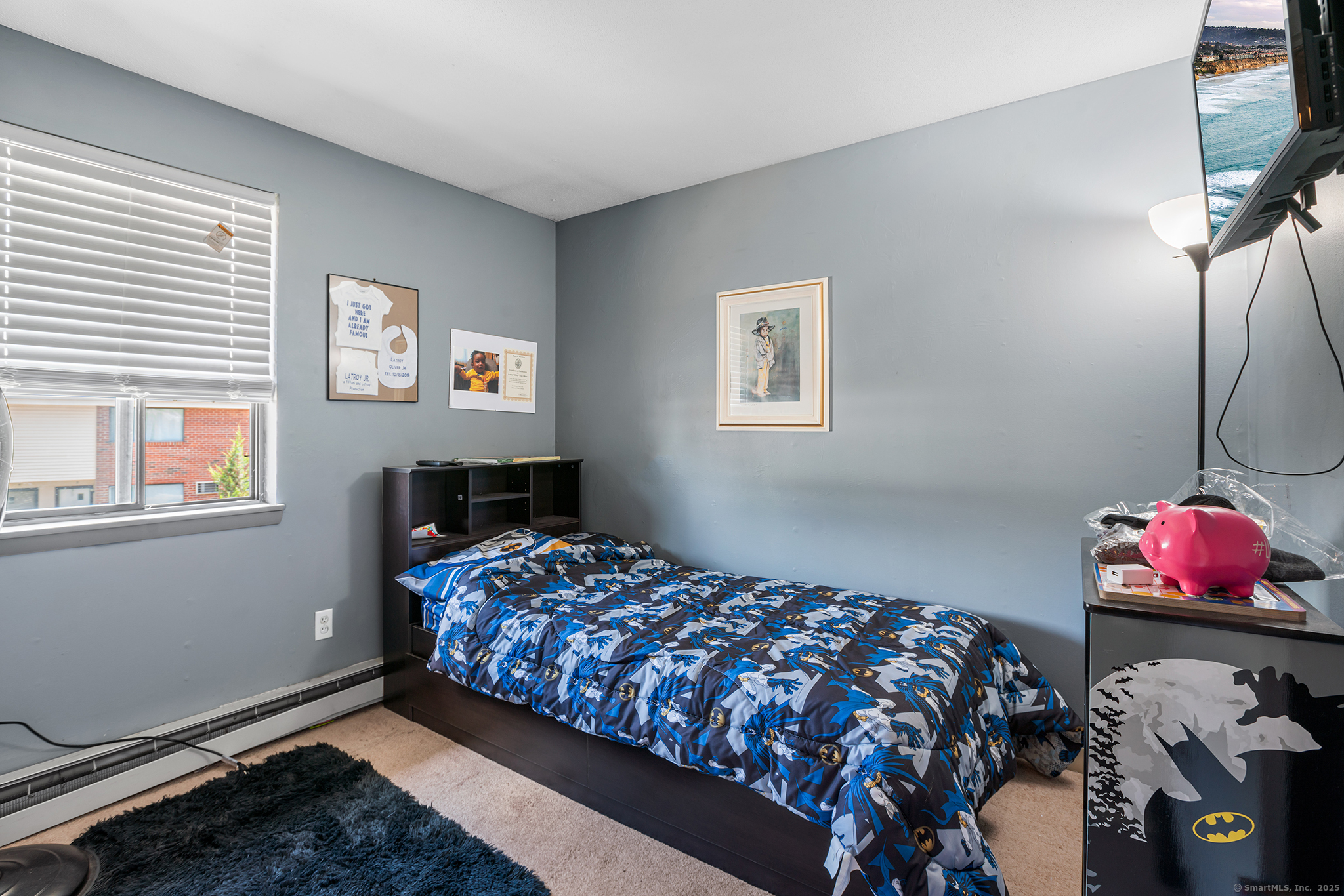 205 Homestead Street, Unit B3 Manchester, CT 06042 - Photo 13 of 26 a bedroom with a bed and wooden floor