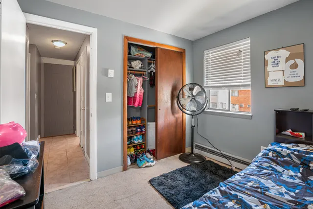 a bed room with a bed and a window