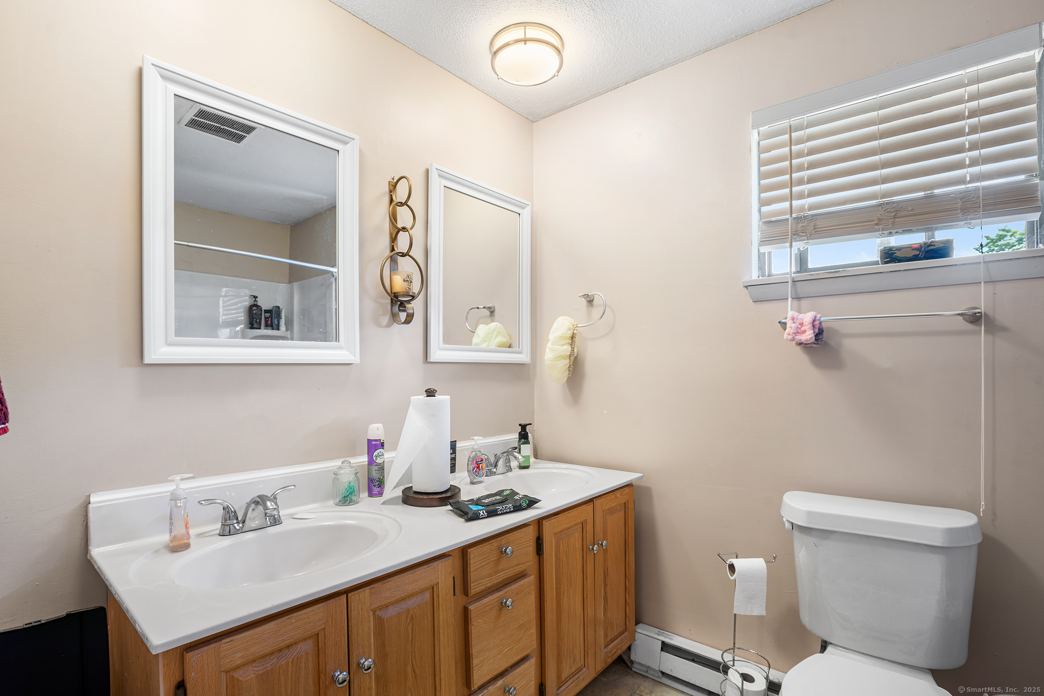 205 Homestead Street, Unit B3 Manchester, CT 06042 - Photo 17 of 26 a bathroom with a sink vanity granite toilet and a mirror