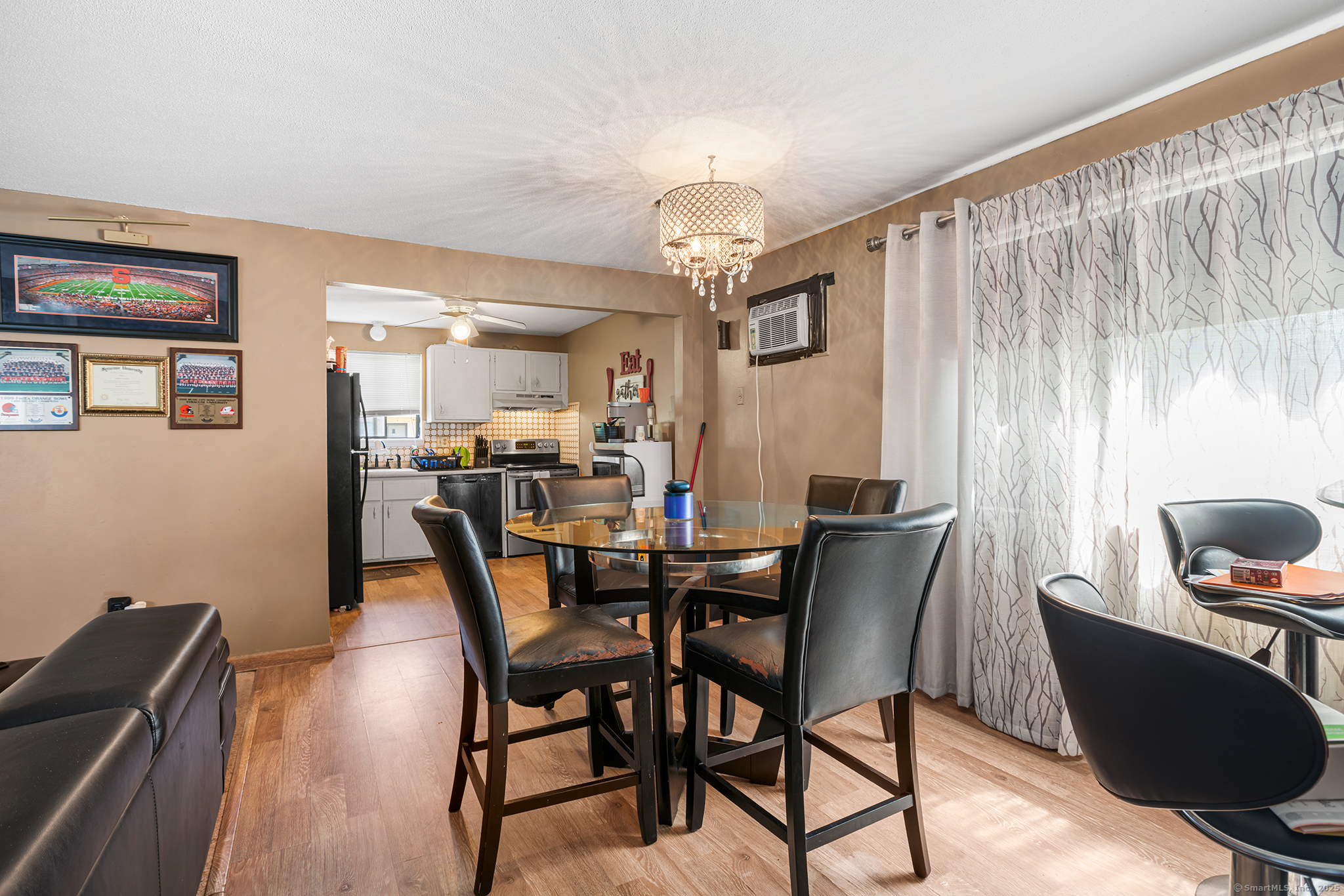 205 Homestead Street, Unit B3 Manchester, CT 06042 - Photo 6 of 26 a view of a dining room with furniture and chandelier