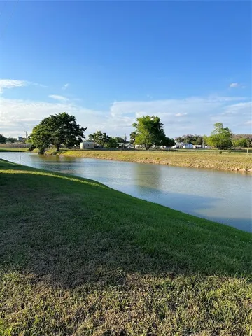 a view of a lake with a city