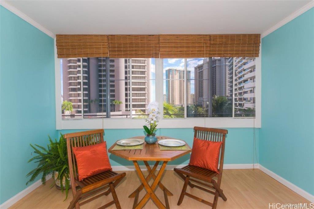 a view of a dining room with furniture window and outside view