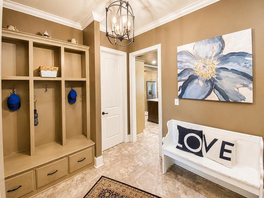 295 North Ridge Drive Saltillo, MS 38866 - Photo 21 of 38 a view of a hallway with wooden floor and chandelier
