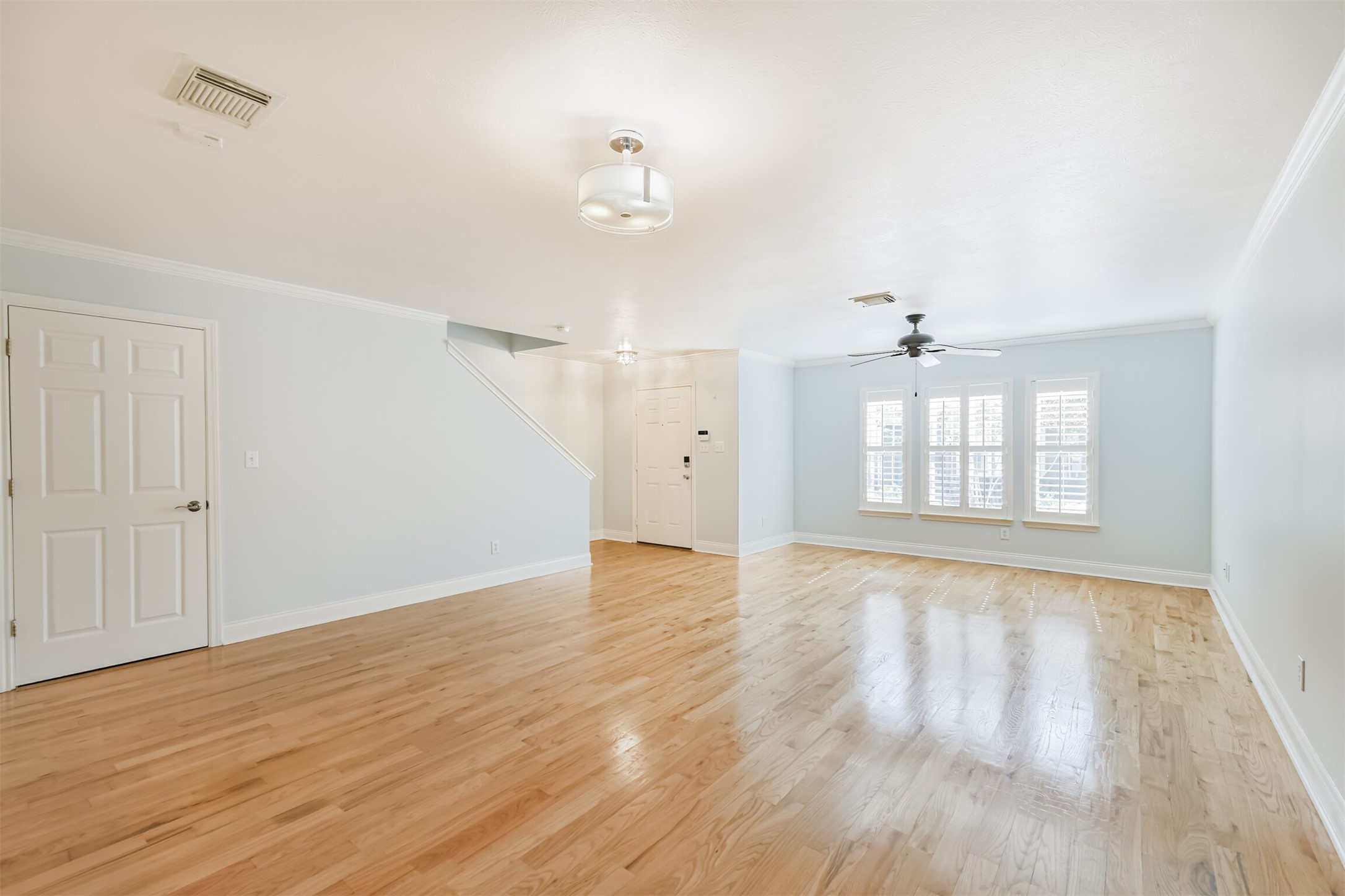 738 Redwing Pl Drive Houston, TX 77009 - Photo 18 of 23 wooden floor in an empty room with a window