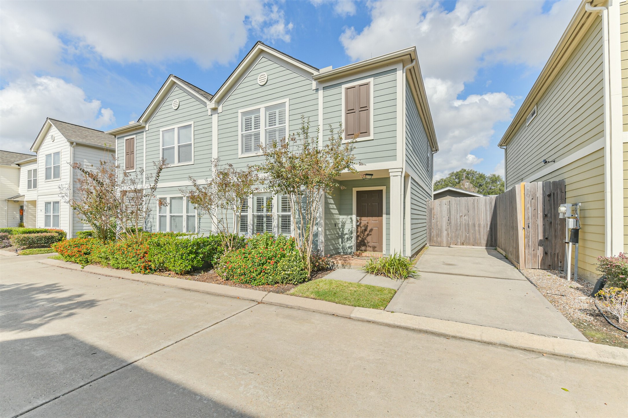 738 Redwing Pl Drive Houston, TX 77009 - Photo 23 of 23 a front view of a house with a yard and potted plants