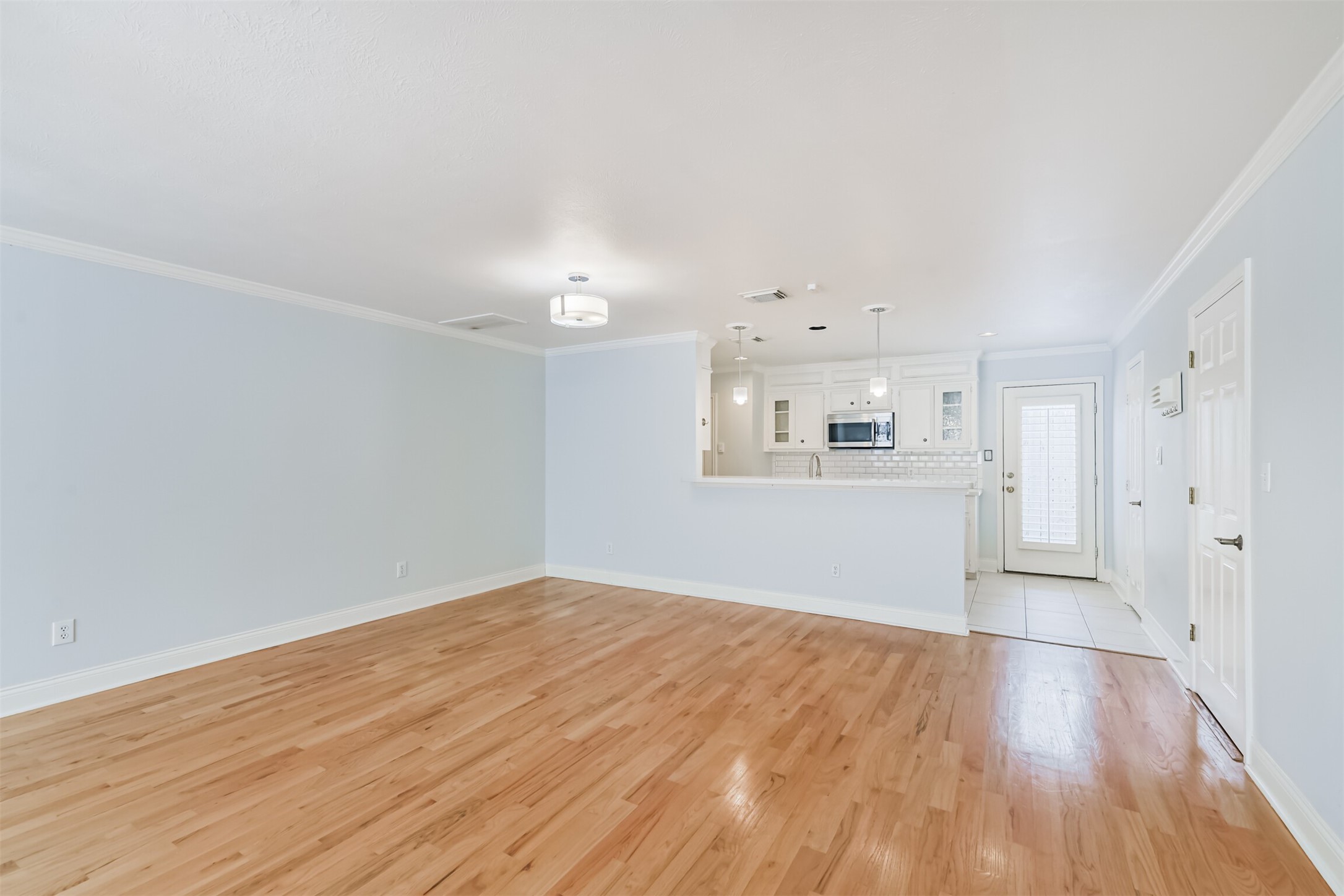 738 Redwing Pl Drive Houston, TX 77009 - Photo 5 of 23 Seamless flow between living/dining area and the kitchen enhance the modern feel of the main floor.