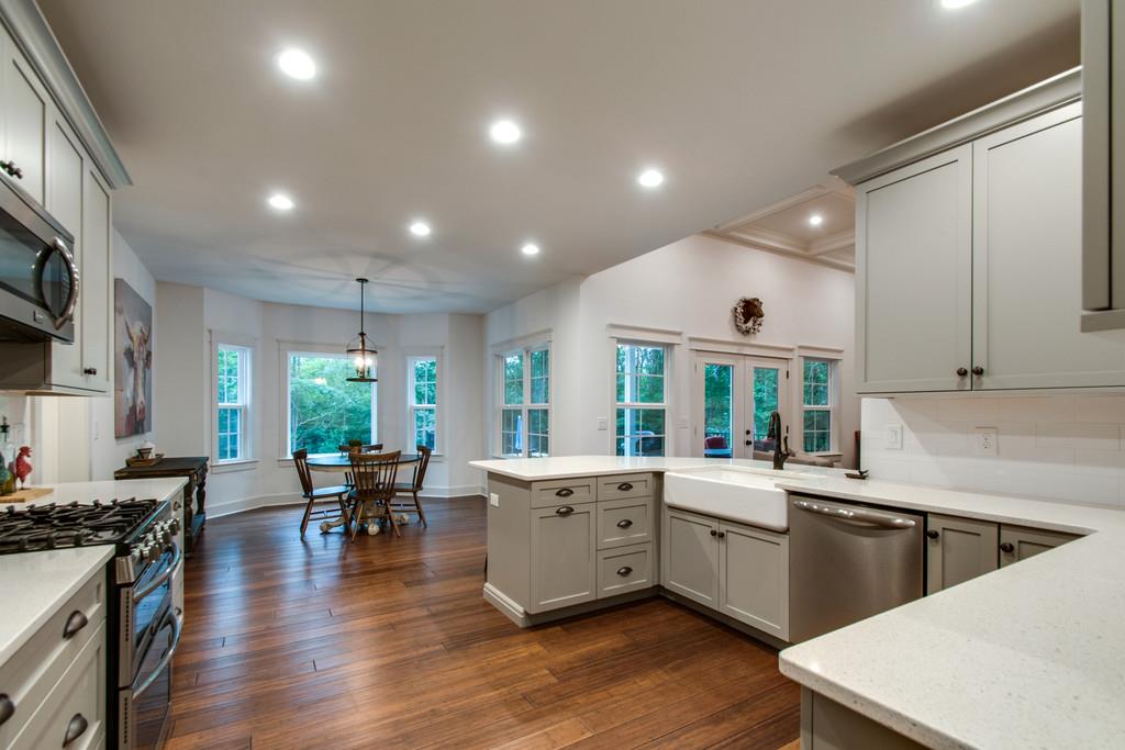 1335 Camp Ravine Road Burns, TN 37029 - Photo 13 of 29 a large white kitchen with lots of counter space a sink and appliances