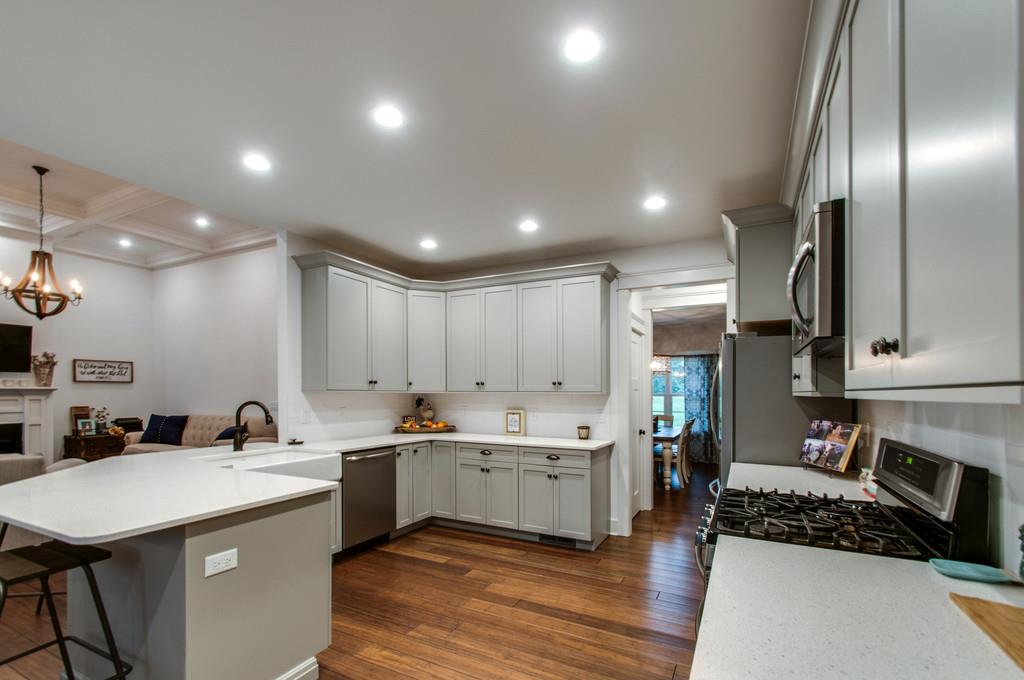 1335 Camp Ravine Road Burns, TN 37029 - Photo 19 of 29 a kitchen with a sink stainless steel appliances and white cabinets