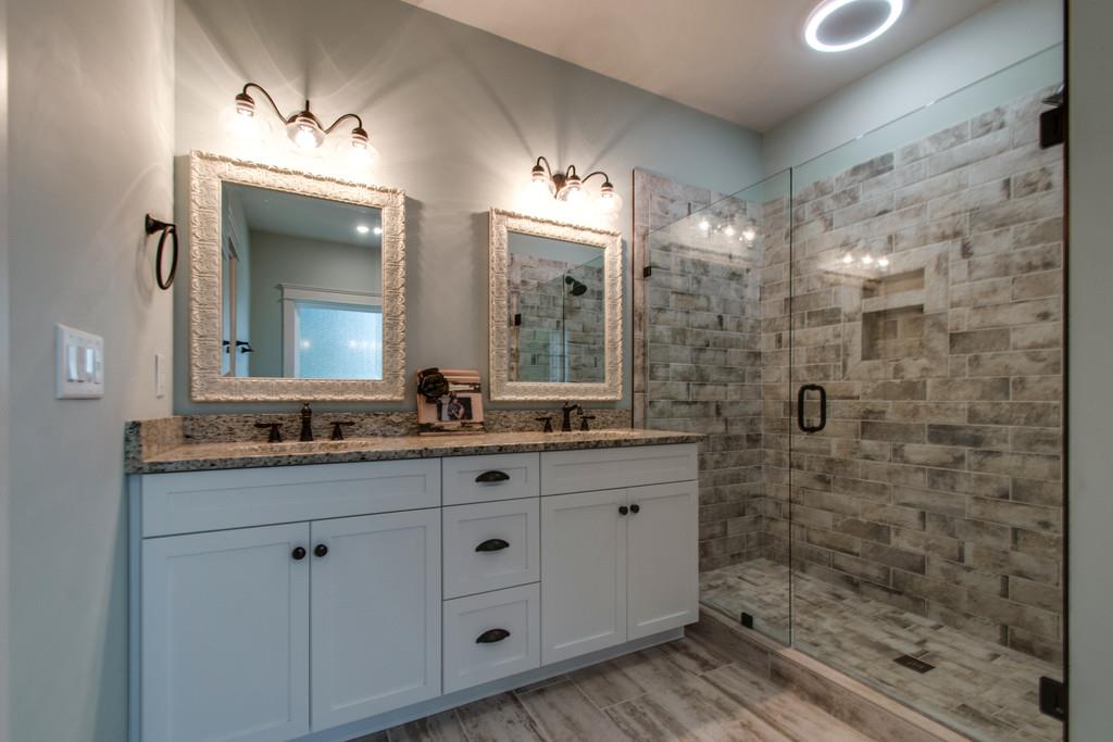 1335 Camp Ravine Road Burns, TN 37029 - Photo 23 of 29 a bathroom with a double vanity sink mirror and shower
