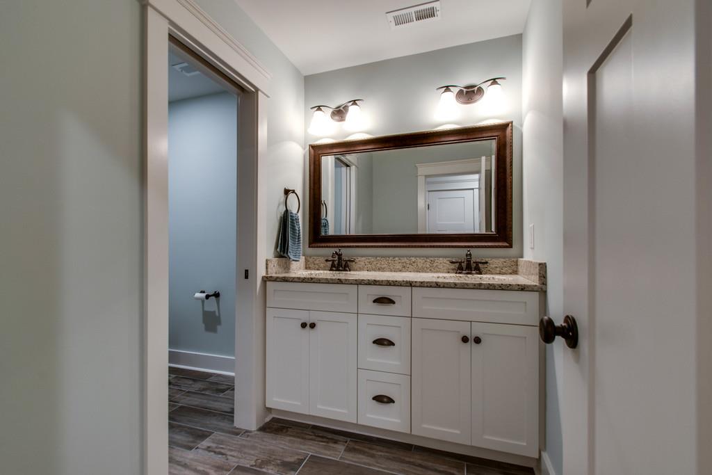1335 Camp Ravine Road Burns, TN 37029 - Photo 25 of 29 a bathroom with mirror and sink