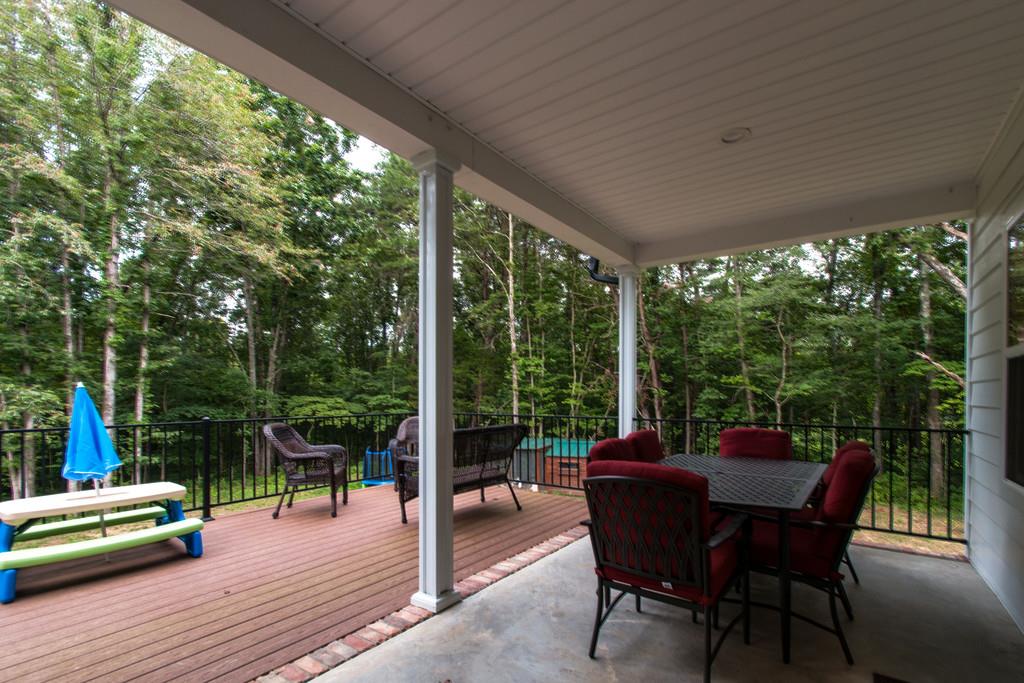 1335 Camp Ravine Road Burns, TN 37029 - Photo 26 of 29 a dining room with furniture and garden view