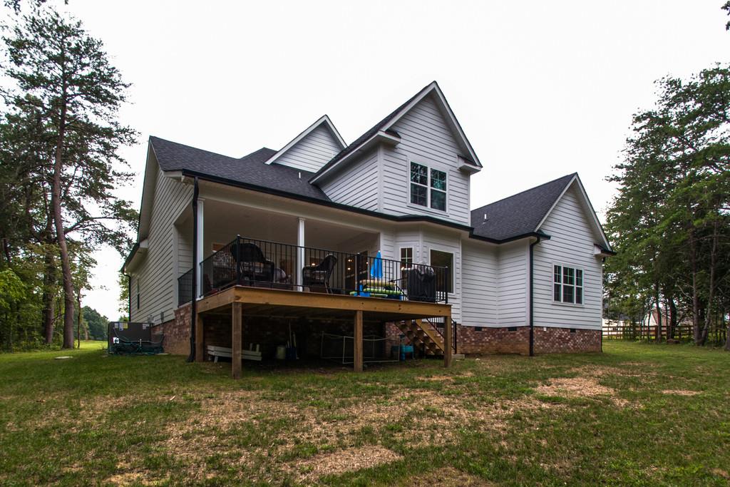 1335 Camp Ravine Road Burns, TN 37029 - Photo 29 of 29 a view of a house with a yard and sitting area