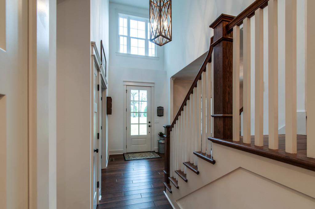 1335 Camp Ravine Road Burns, TN 37029 - Photo 3 of 29 a view of an entryway with wooden floor and stairs