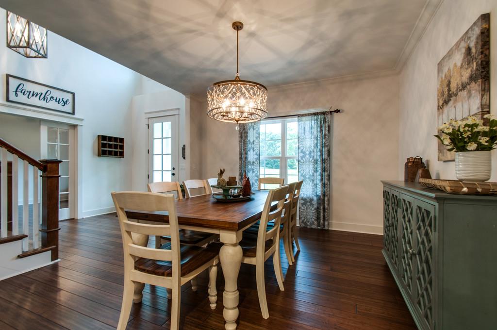 1335 Camp Ravine Road Burns, TN 37029 - Photo 4 of 29 a view of a dining room with furniture window and wooden floor