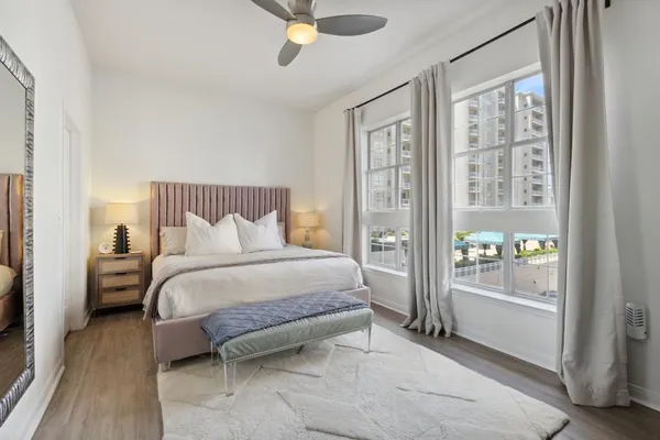 a bedroom with a large bed and a window