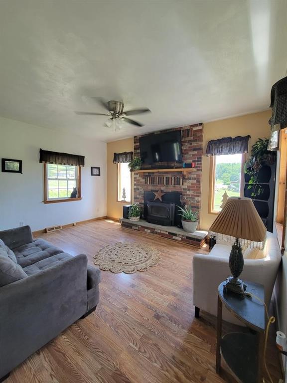 467 Hickory Square Road Connellsville, PA 15425 - Photo 8 of 17 a living room with furniture and a fireplace