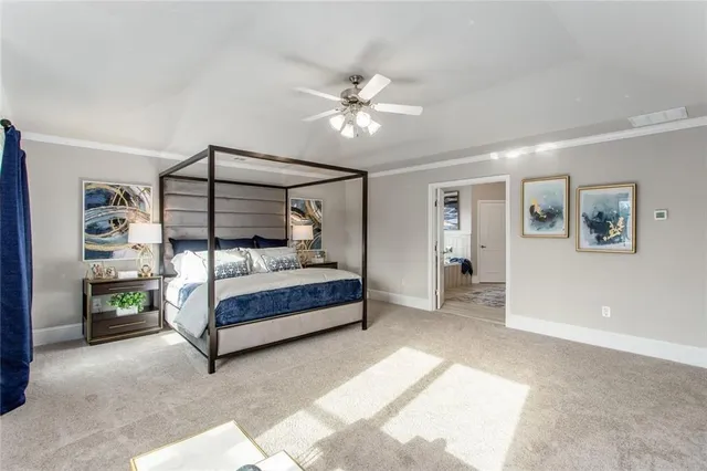 a bedroom with a bed window and a ceiling fan