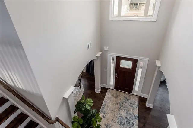 a view of stairs and hardwood floor