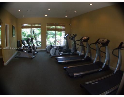 12130 St Andrews Place, Unit 101 Miramar, FL 33025 - Photo 11 of 13 a view of a room with gym equipment