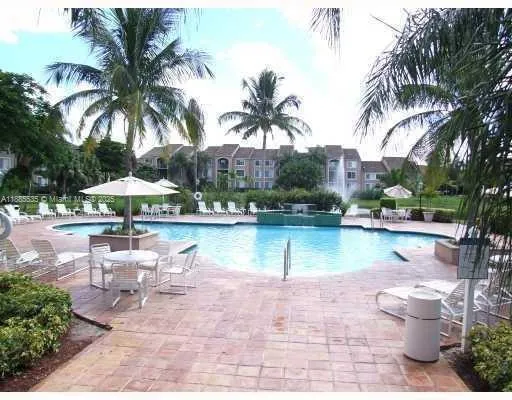 a view of a patio with swimming pool