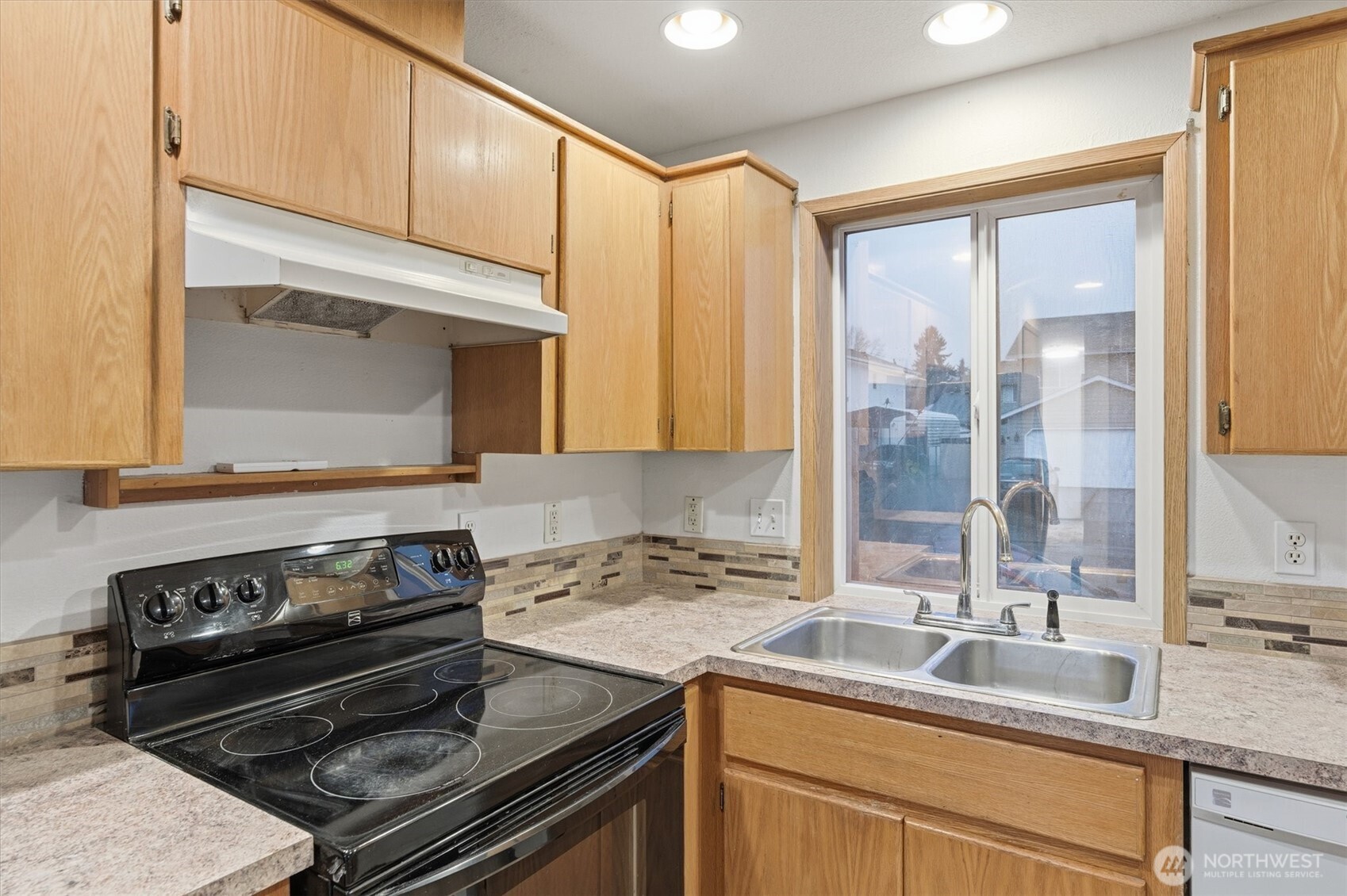 107 Mission Road Kelso, WA 98626 - Photo 11 of 32 a kitchen with a stove and a sink