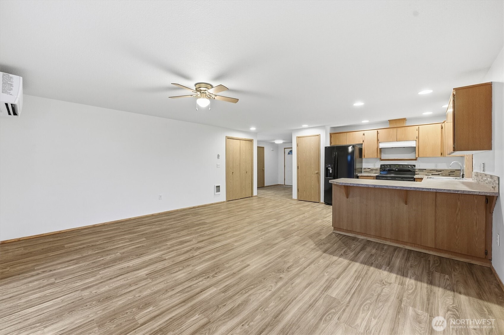 107 Mission Road Kelso, WA 98626 - Photo 14 of 32 a large kitchen with kitchen island a sink stainless steel appliances and cabinets