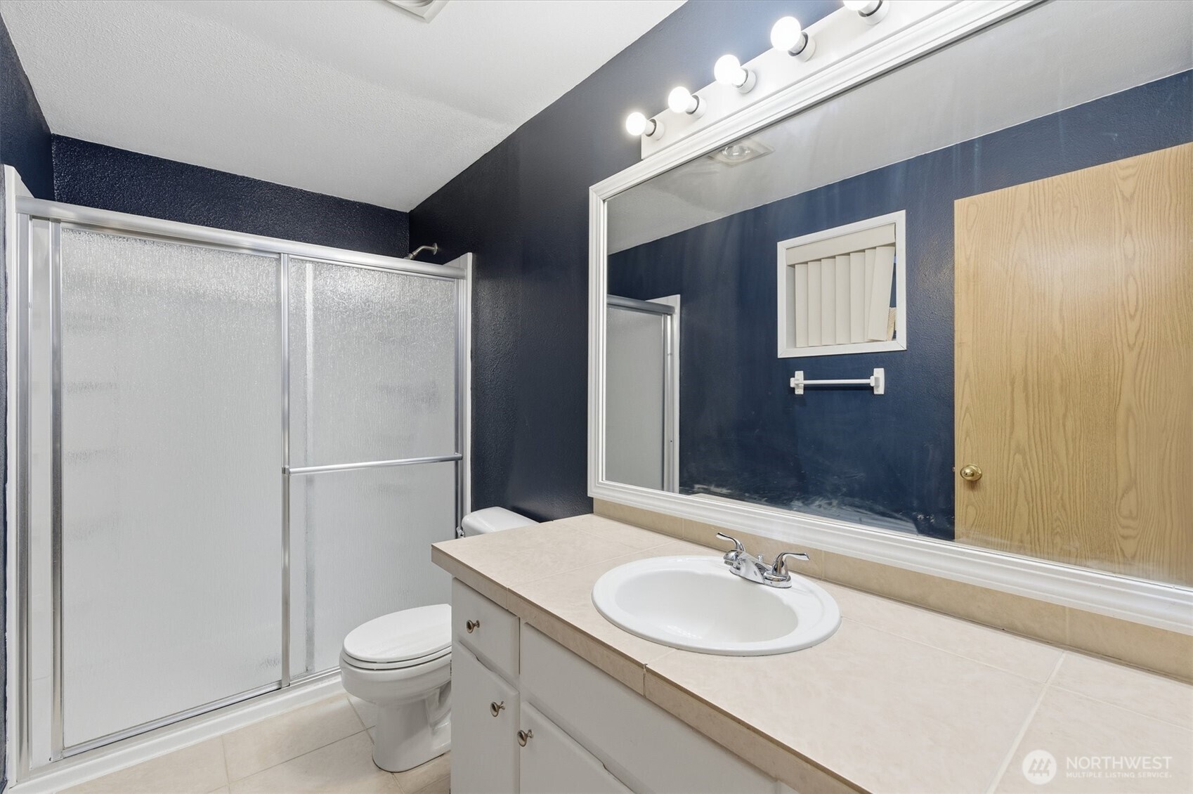 107 Mission Road Kelso, WA 98626 - Photo 26 of 32 a bathroom with a granite countertop sink toilet and shower
