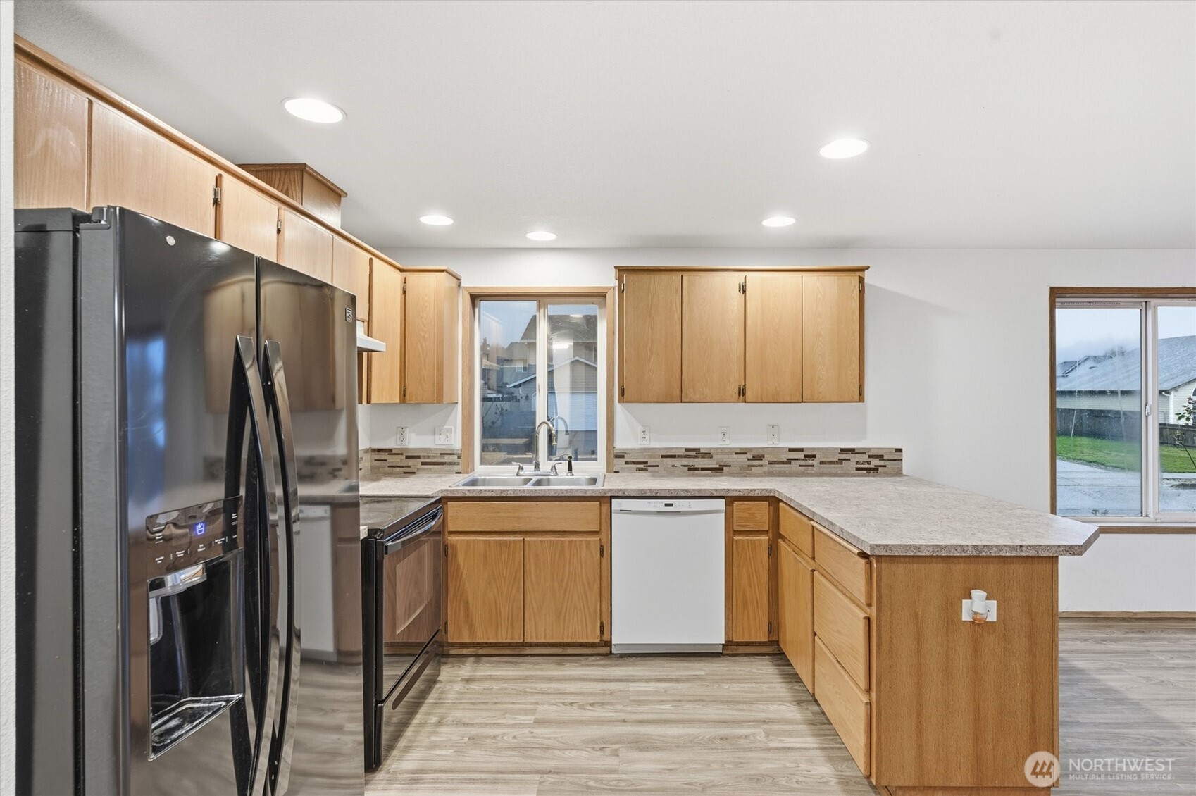 107 Mission Road Kelso, WA 98626 - Photo 8 of 32 a kitchen with stainless steel appliances granite countertop a sink stove and refrigerator