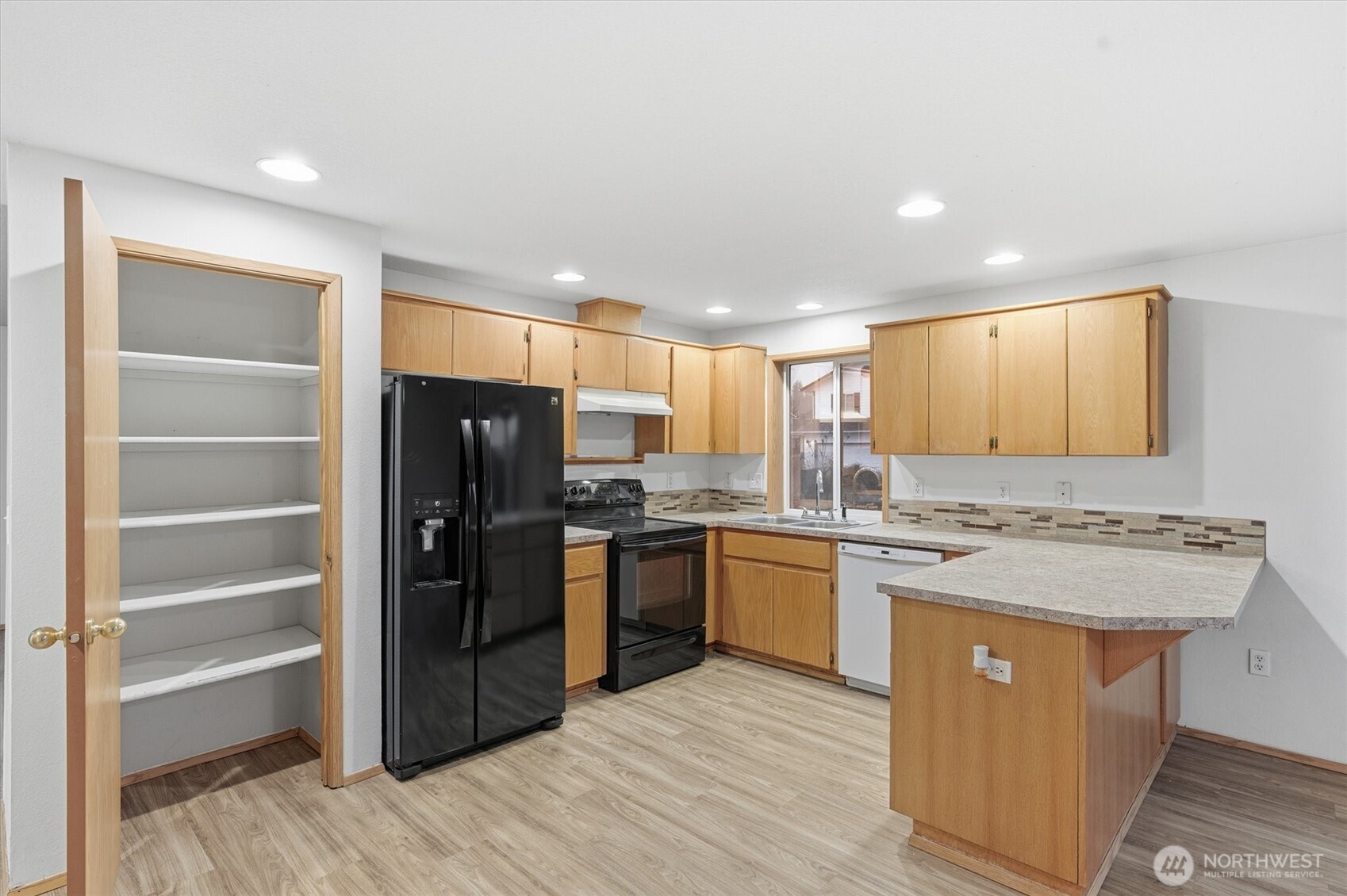 107 Mission Road Kelso, WA 98626 - Photo 9 of 32 a kitchen with stainless steel appliances granite countertop a sink stove and refrigerator