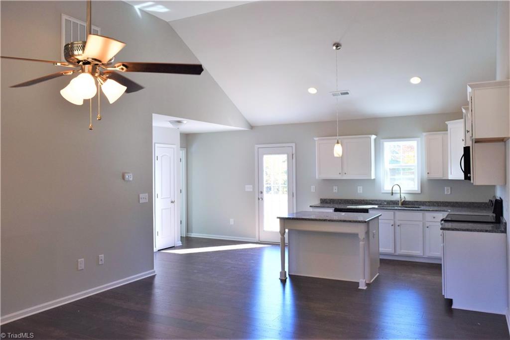 7719 Athens Road Stokesdale, NC 27357 - Photo 16 of 16 Open floorplan between living room and kitchen/dining area