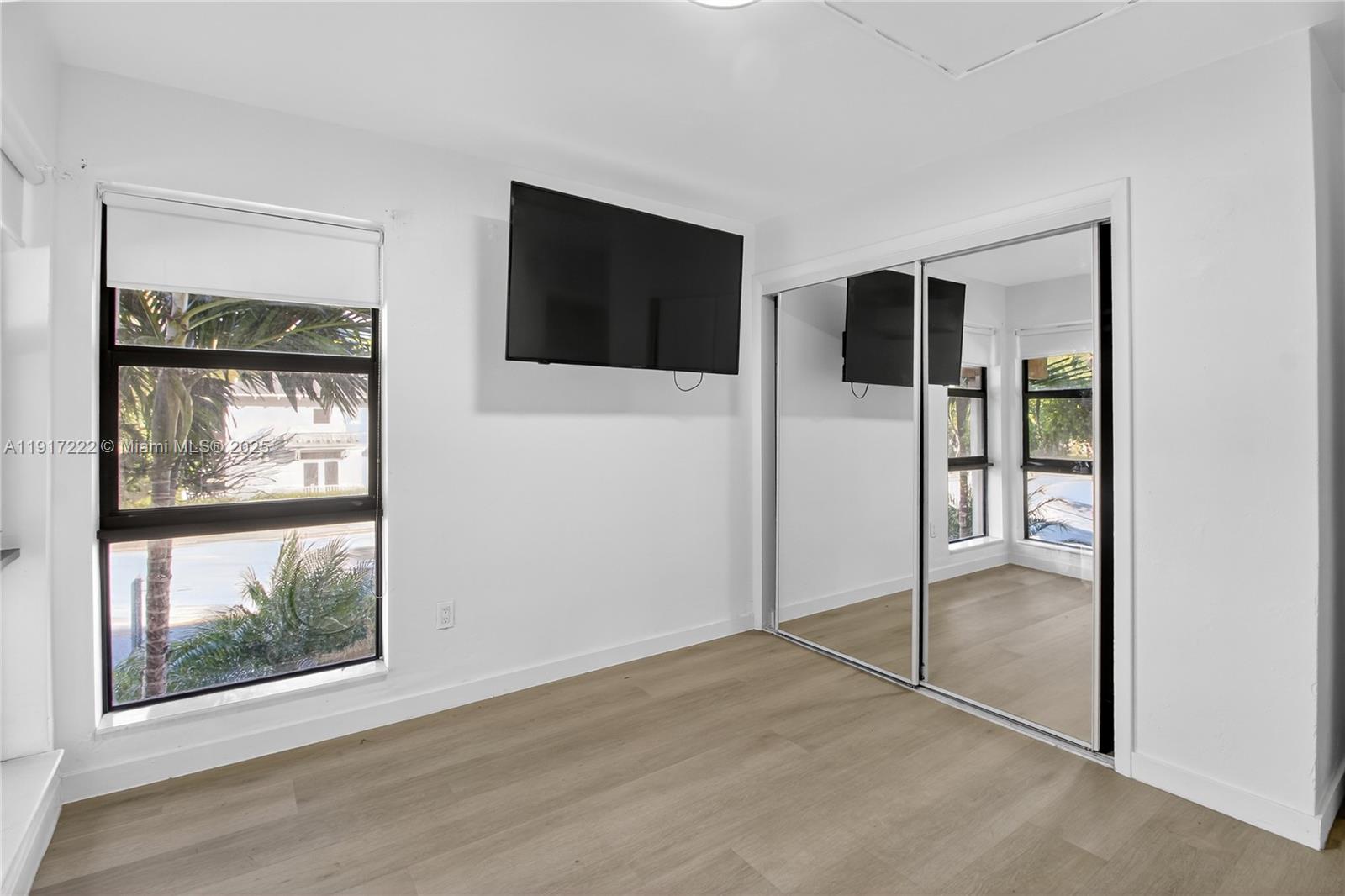 1600 South Le Jeune Road, Unit 7 Coral Gables, FL 33134 - Photo 13 of 20 a view of an empty room with window and cabinet