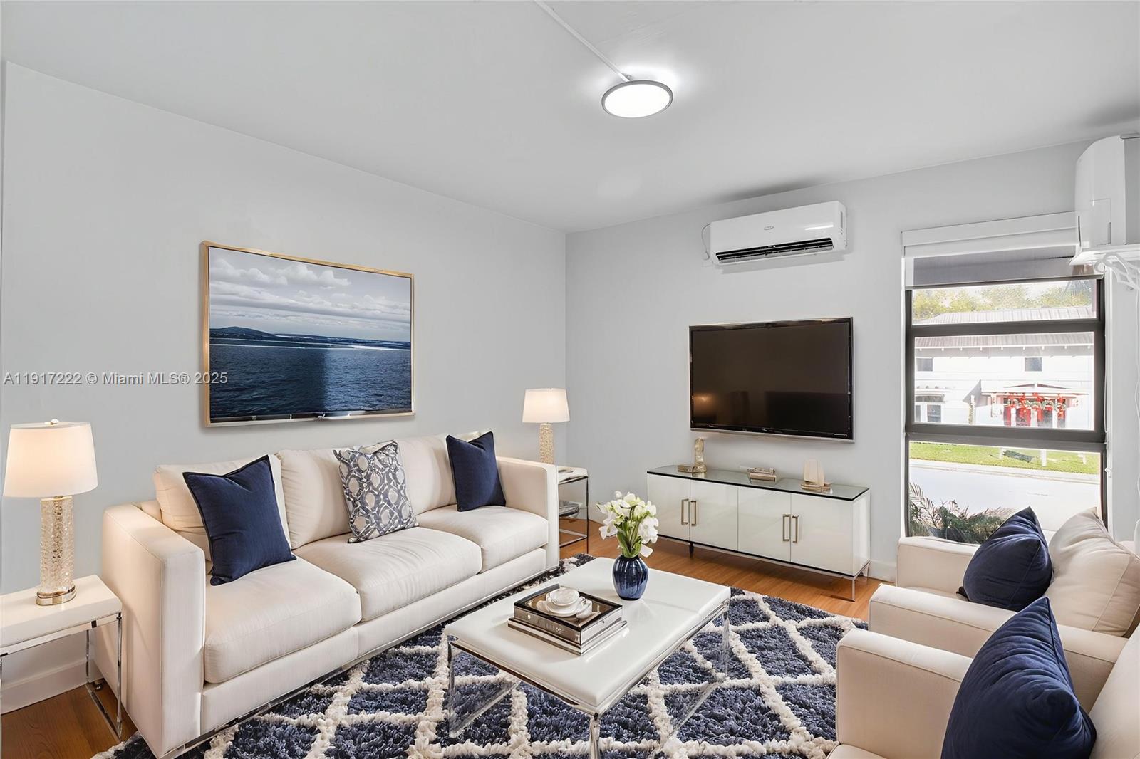 1600 South Le Jeune Road, Unit 7 Coral Gables, FL 33134 - Photo 6 of 20 a living room with furniture and a flat screen tv