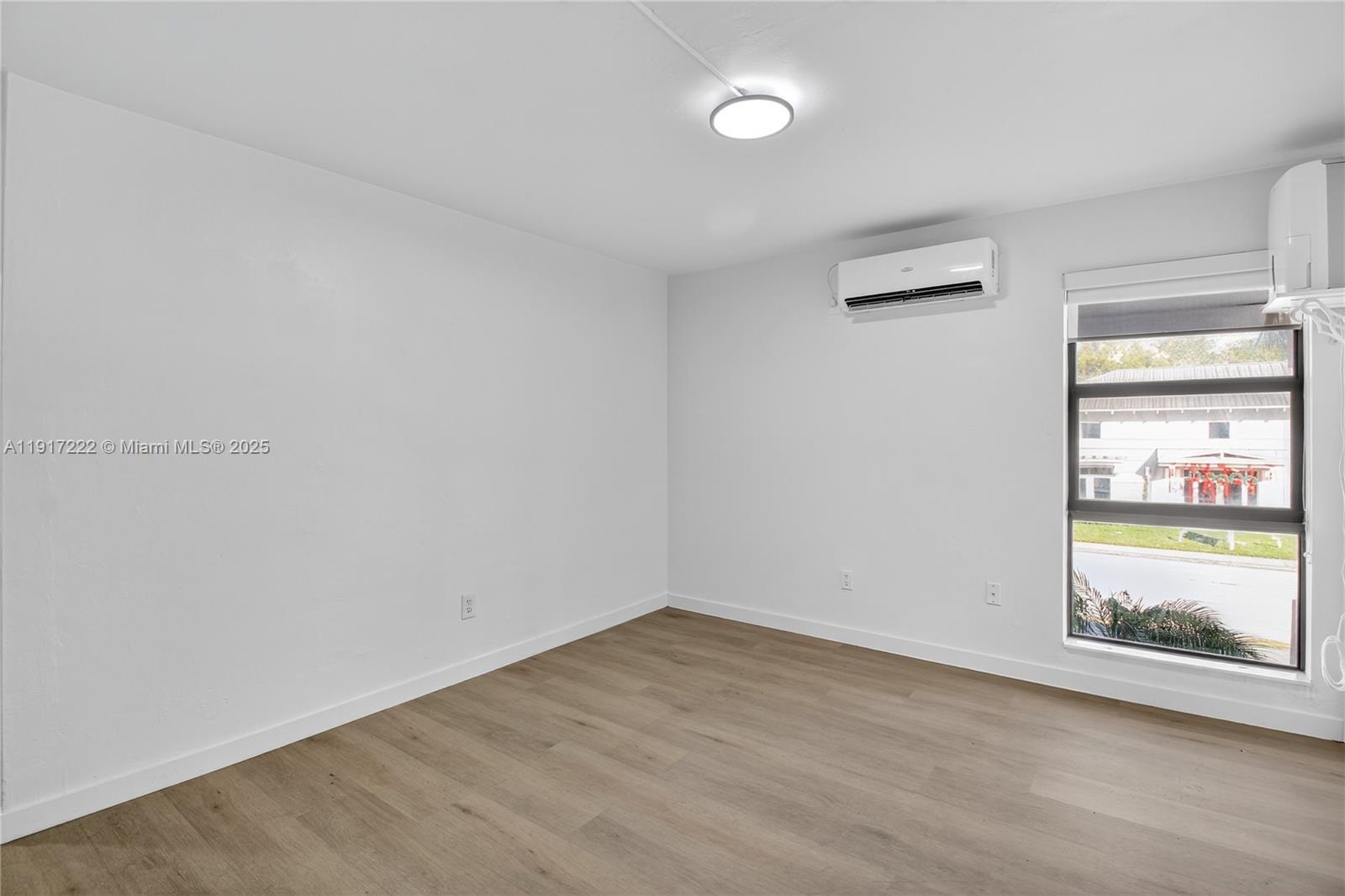 1600 South Le Jeune Road, Unit 7 Coral Gables, FL 33134 - Photo 7 of 20 an empty room with window