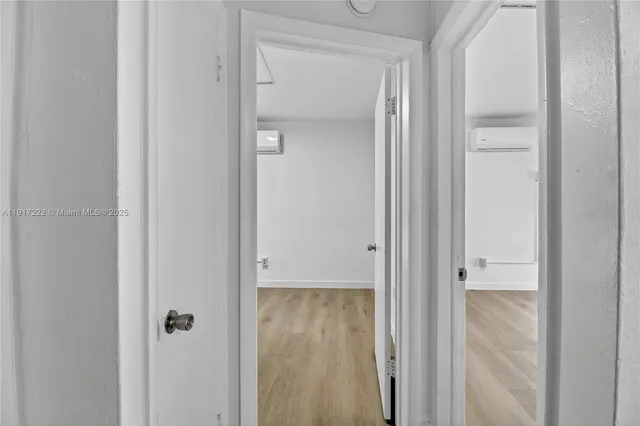 a view of a bathroom from a hallway