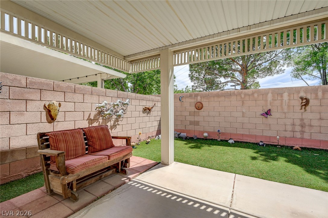 1479 Orange Jubilee Road Henderson, NV 89014 - Photo 31 of 36 An inviting covered patio offers a private outdoor retreat for relaxation and entertainment.
