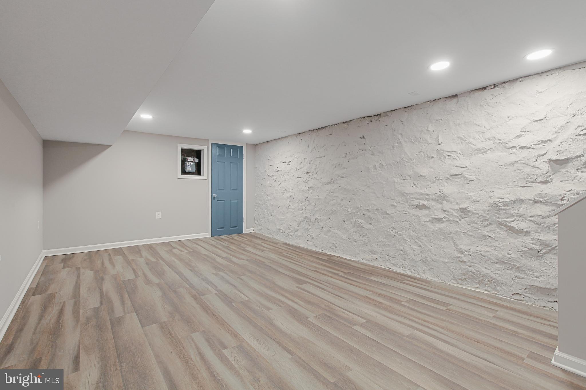 2712 Mosher Street Baltimore, MD 21216 - Photo 28 of 37 a view of an empty room with wooden floor
