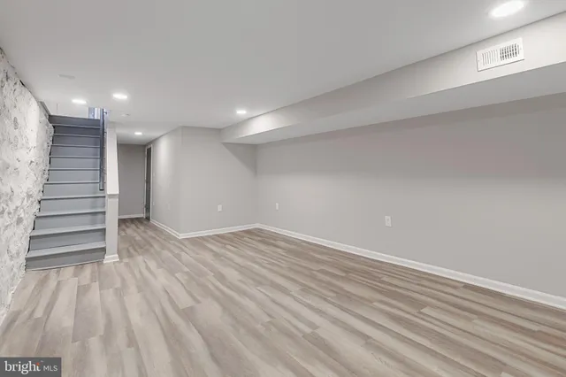 a bathroom with a toilet a sink and shower