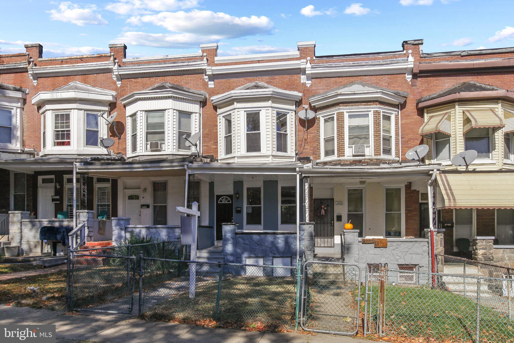 2712 Mosher Street Baltimore, MD 21216 - Photo 4 of 37 front view of a building with a fountain