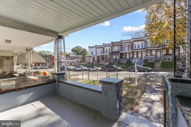 a view of a swimming pool with outdoor seating