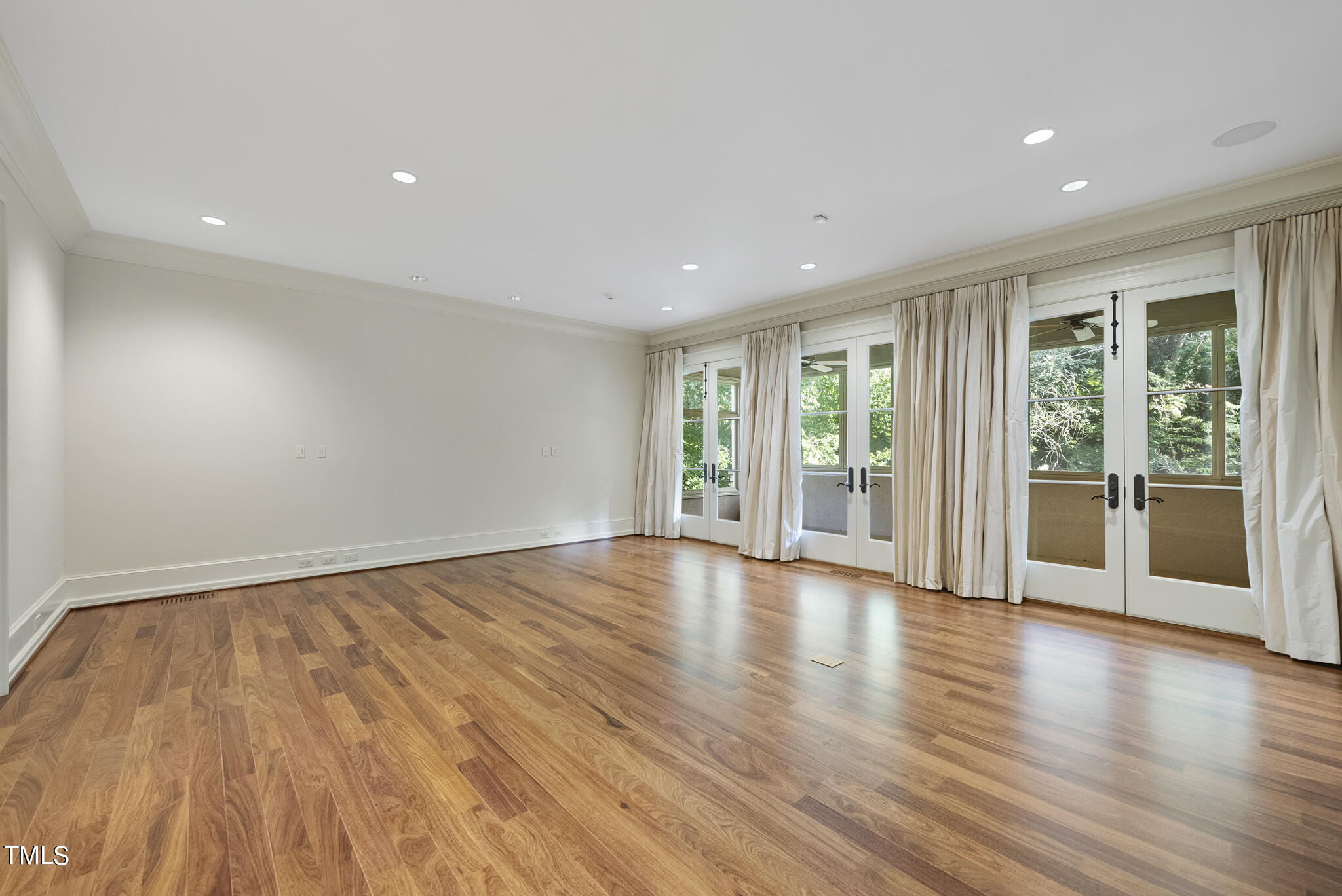 3319 White Oak Road Raleigh, NC 27609 - Photo 17 of 47 a view of an empty room with wooden floor and a window