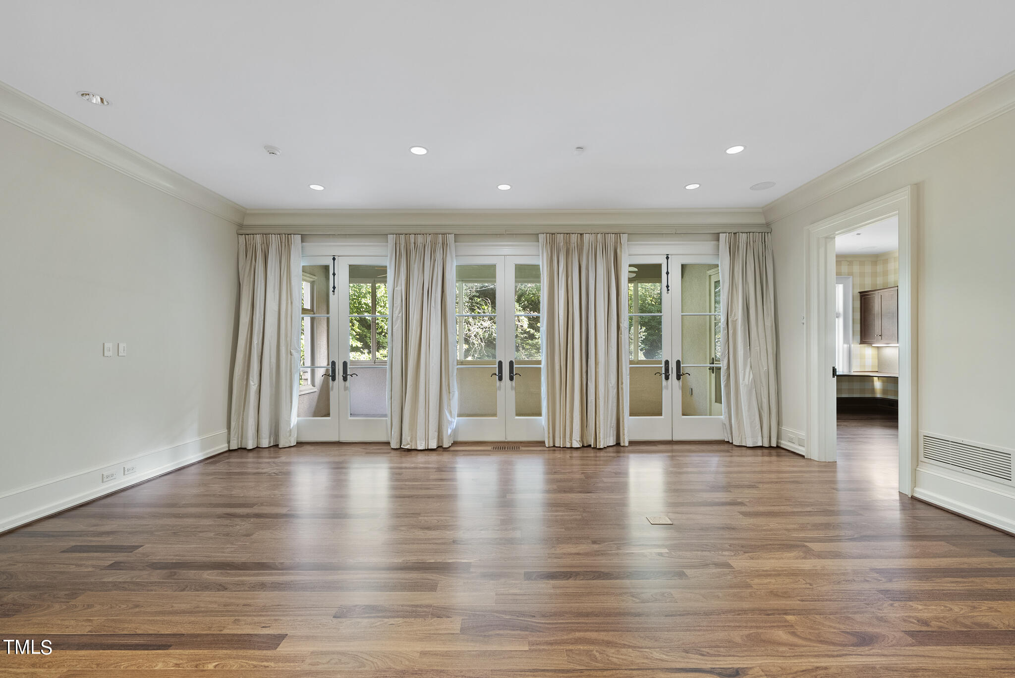 3319 White Oak Road Raleigh, NC 27609 - Photo 18 of 47 a view of an entryway with wooden floor and windows