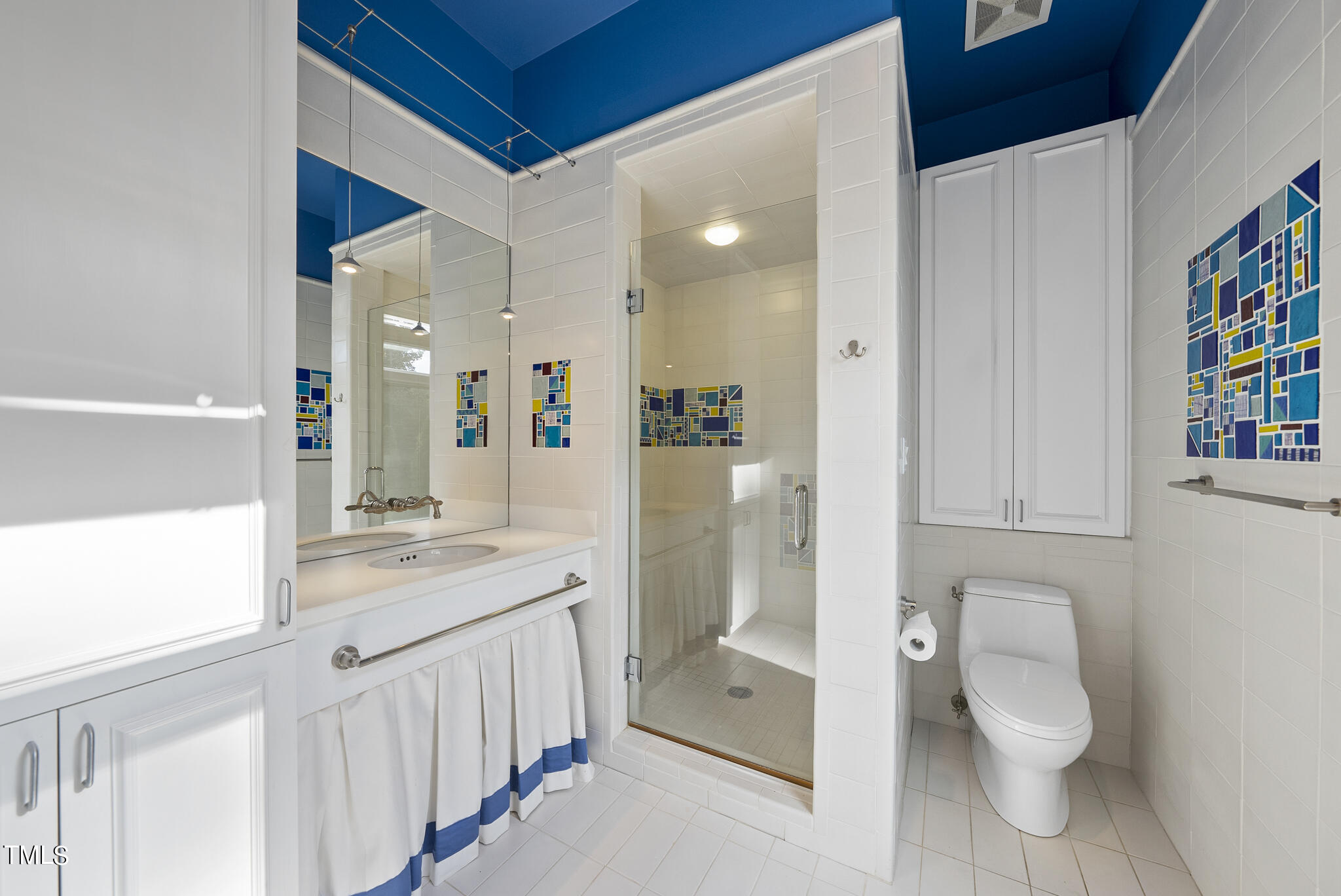 3319 White Oak Road Raleigh, NC 27609 - Photo 24 of 47 a bathroom with a toilet sink and mirror