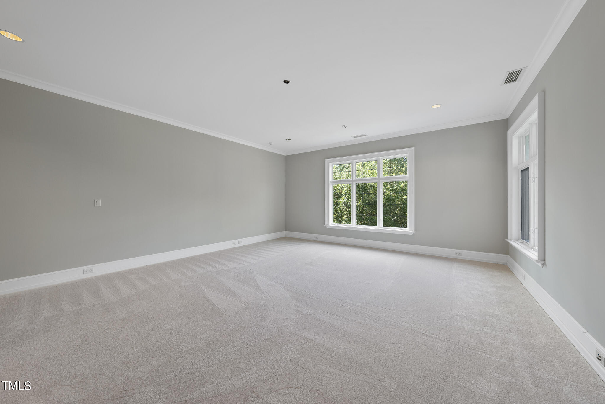 3319 White Oak Road Raleigh, NC 27609 - Photo 32 of 47 a view of a big room with windows and chandelier fan