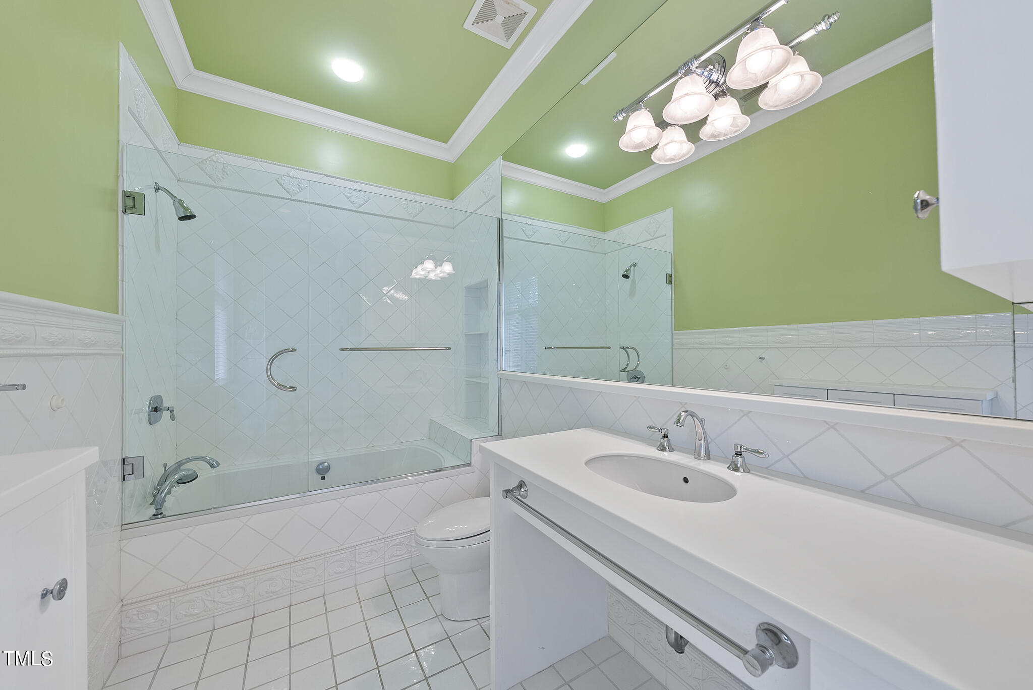 3319 White Oak Road Raleigh, NC 27609 - Photo 33 of 47 a bathroom with a sink a toilet and shower