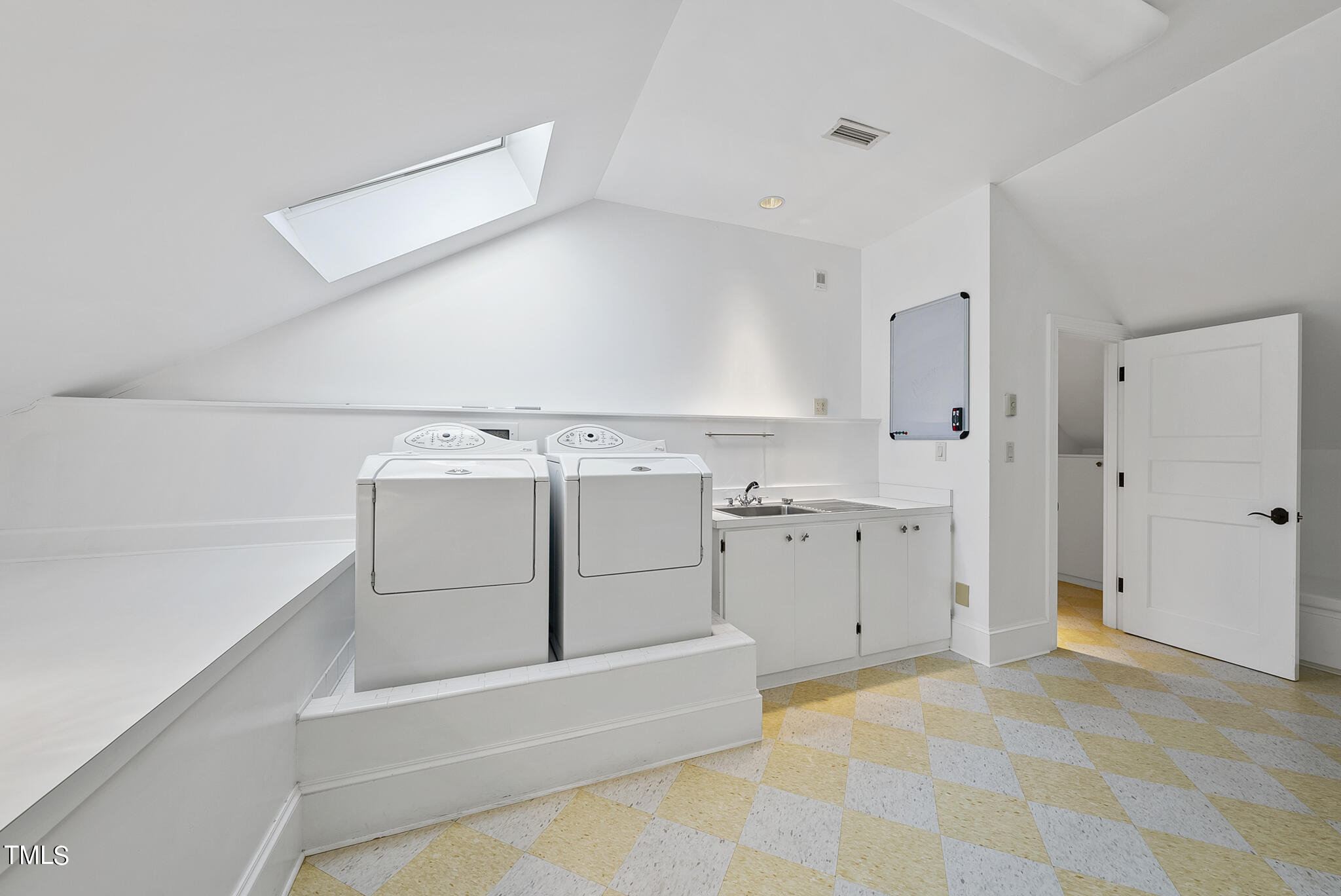 3319 White Oak Road Raleigh, NC 27609 - Photo 34 of 47 a utility room with cabinets washer and dryer