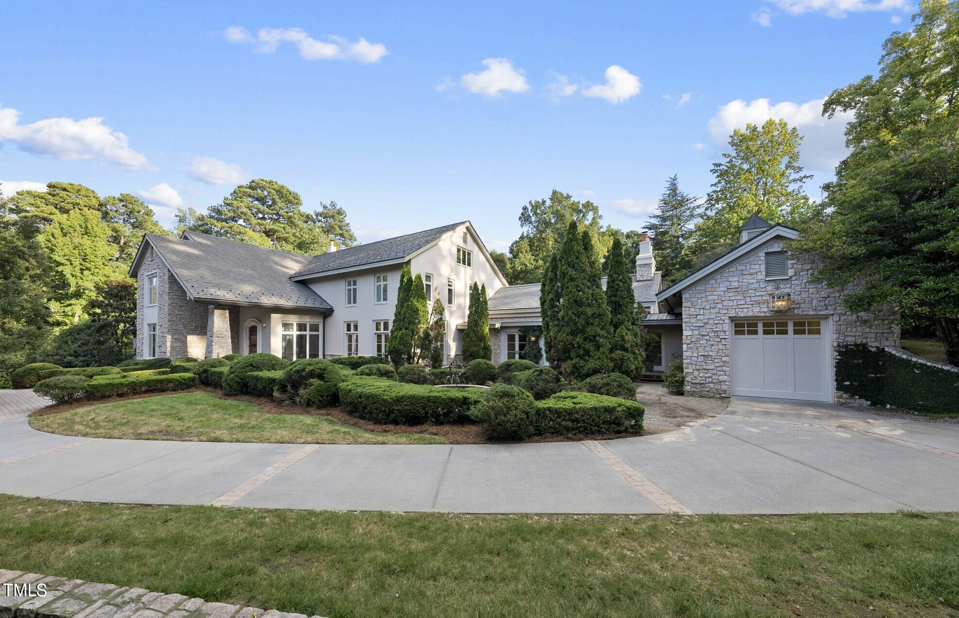 3319 White Oak Road Raleigh, NC 27609 - Photo 7 of 47 a front view of a house with a yard and garage