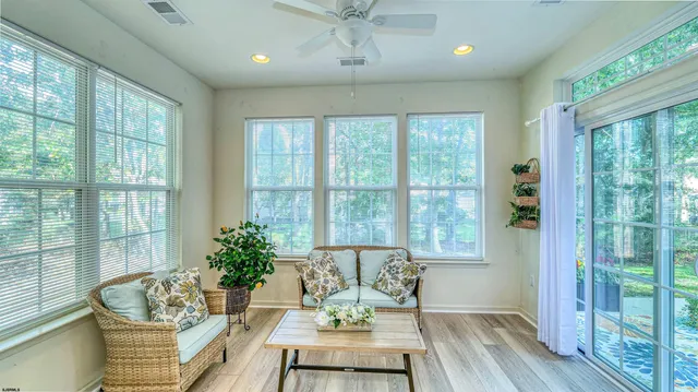 a bedroom with furniture and a window