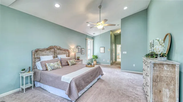 a bathroom with a tub a sink and mirrors