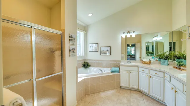 a bathroom with a tub and shower